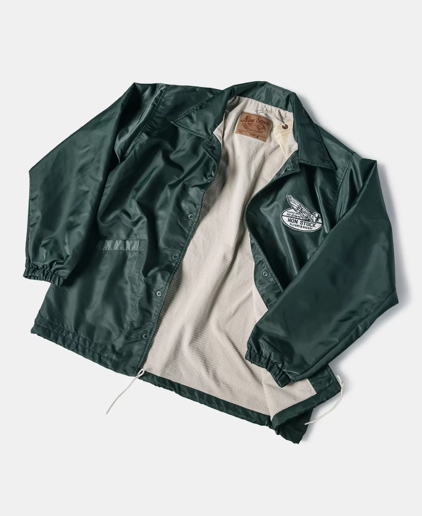 logoappliqued_nylon_coach_jacket__green_2.webp Store Logo-Appliqued Nylon Coach Jacket - Green Jackets & Coats